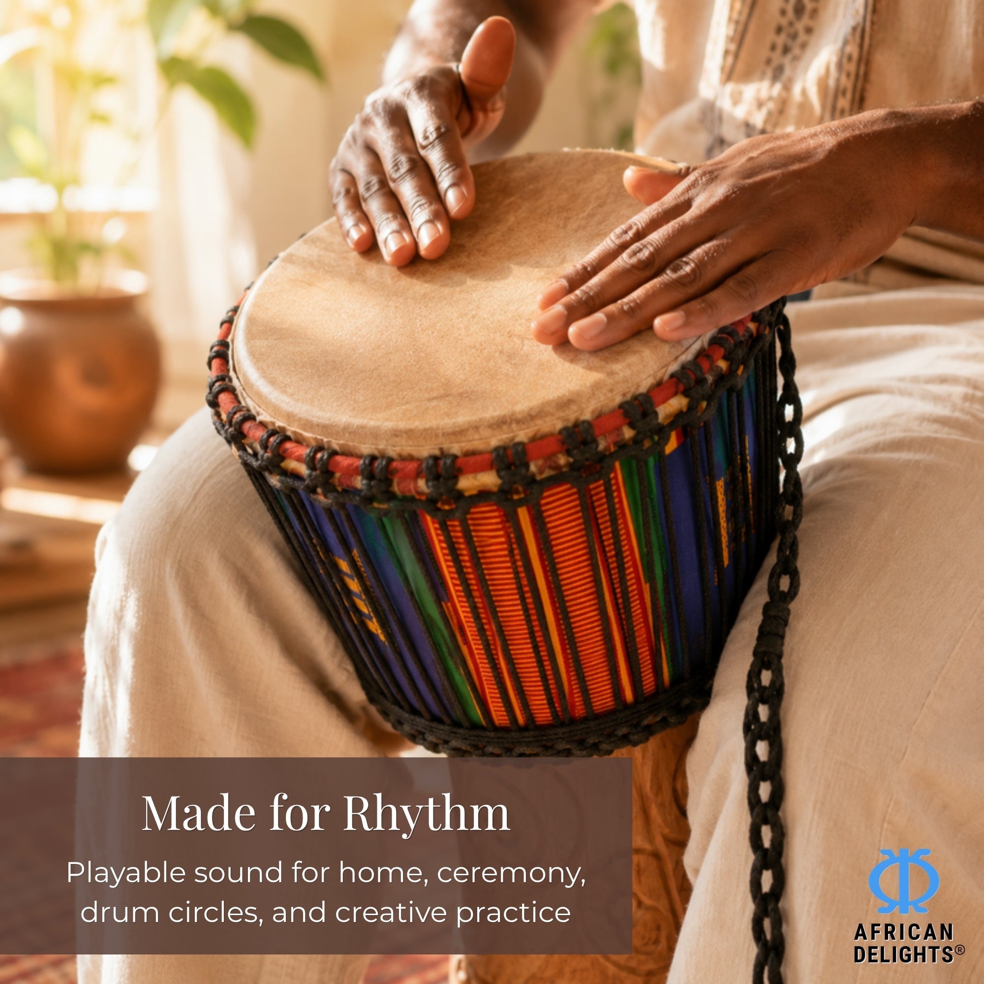 Authentic African djembe drum being played by hands on the natural goat-skin head