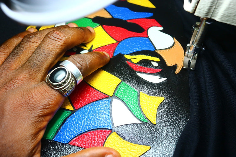 Fela Kuti multicolored on black tank top